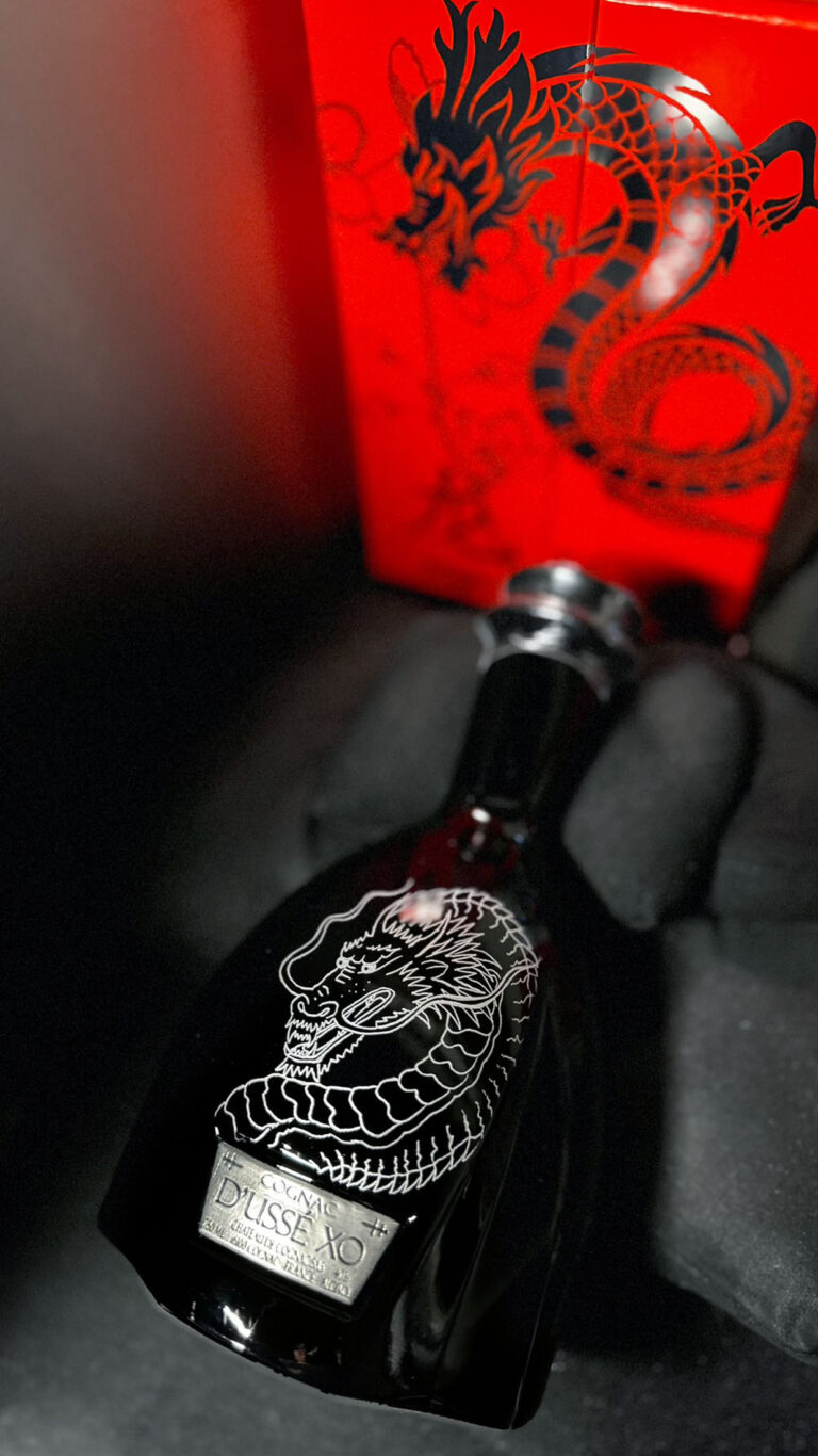 Hand-engraved D'USSÉ bottle by KeeKee Creates with a dragon for Lunar New Year.