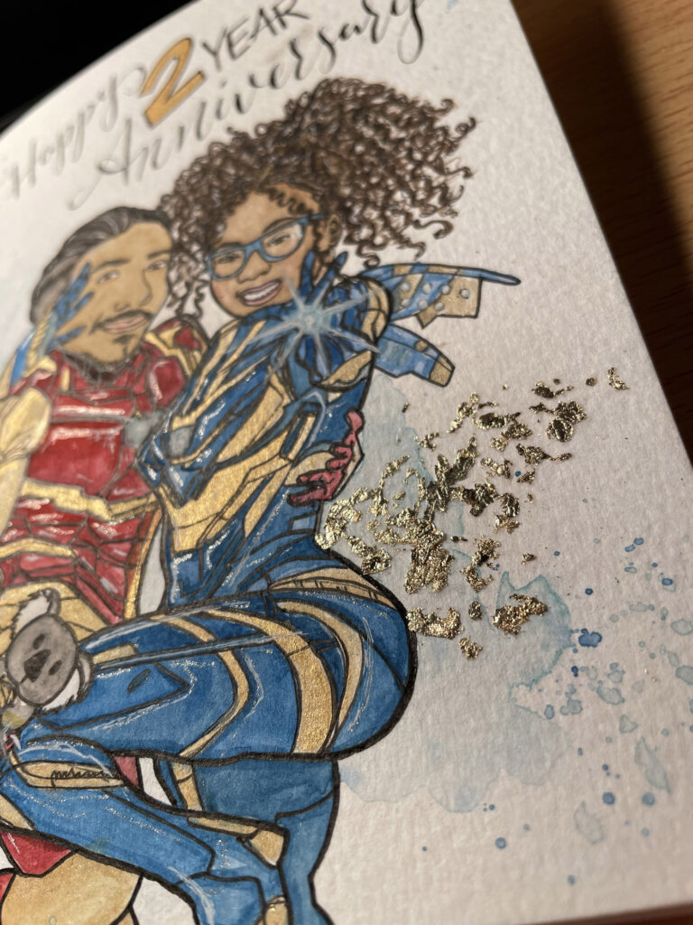 Colorful superhero-themed anniversary card illustration with Iron Man and Wasp characters