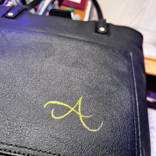 Custom black leather bag with gold foil monogram initial 'A' by KeeKee Creates