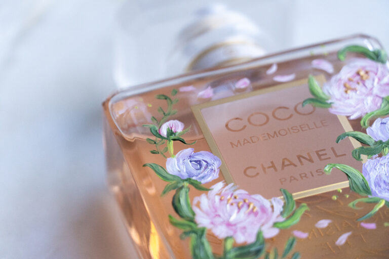 Hand-painted Chanel perfume bottle with soft pink floral design, customized for luxury gifting and weddings