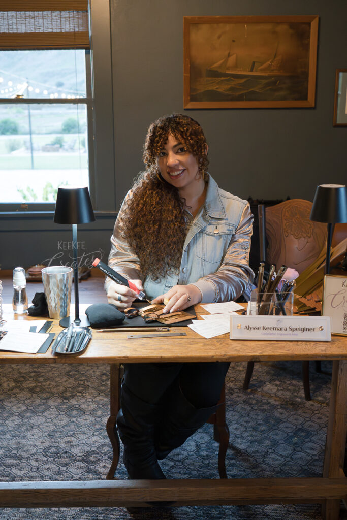 Live event artist customizing gold foil luggage tags at a wedding in Swanner House, Orange County